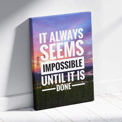 A rectangular canvas print featuring the inspirational it always seems impossible until it is done quote with sunset colors