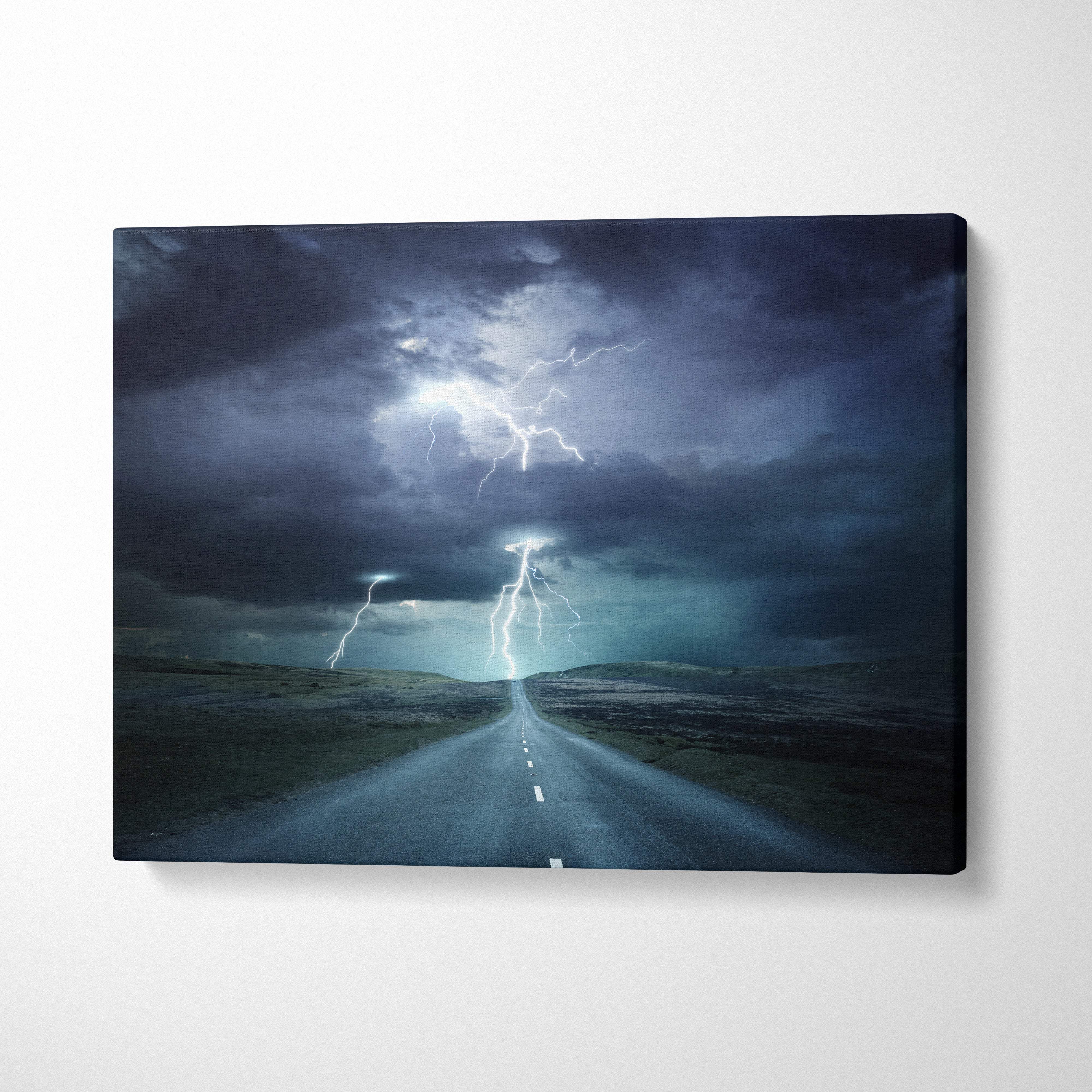 Canvas print of dramatic storm with multiple lightning bolts over empty road dark blue sky electric strikes wall decor