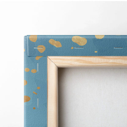Blue teal watercolor gradient canvas with gold confetti accents in light wood frame