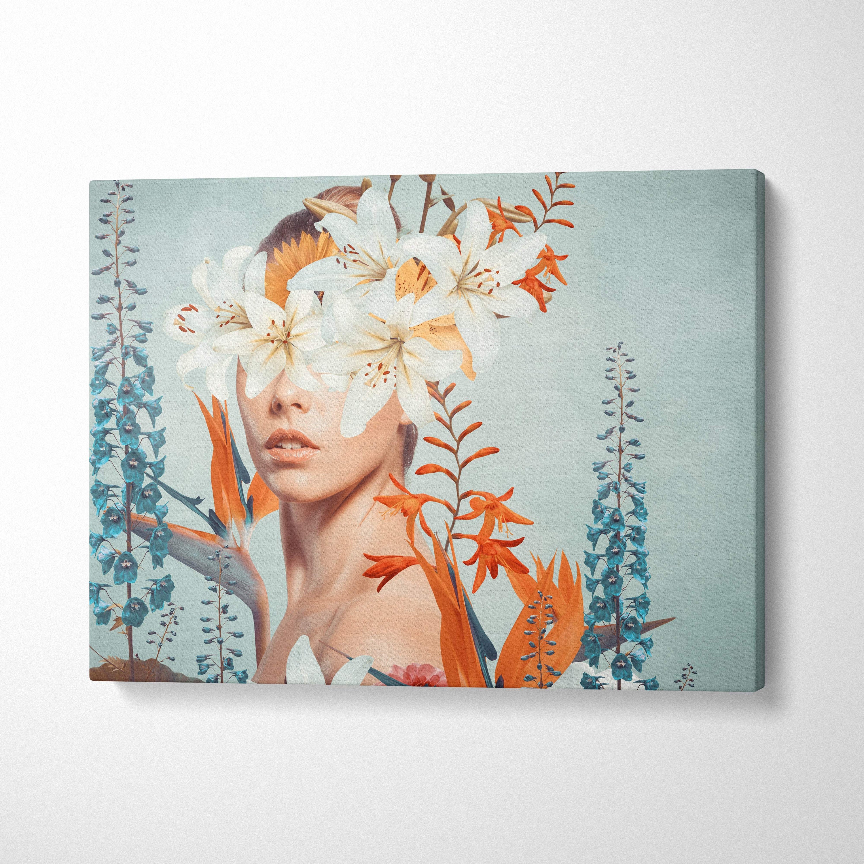 Rectangular canvas print of a woman with white and orange lilies over eyes surrounded by blue and orange floral elements