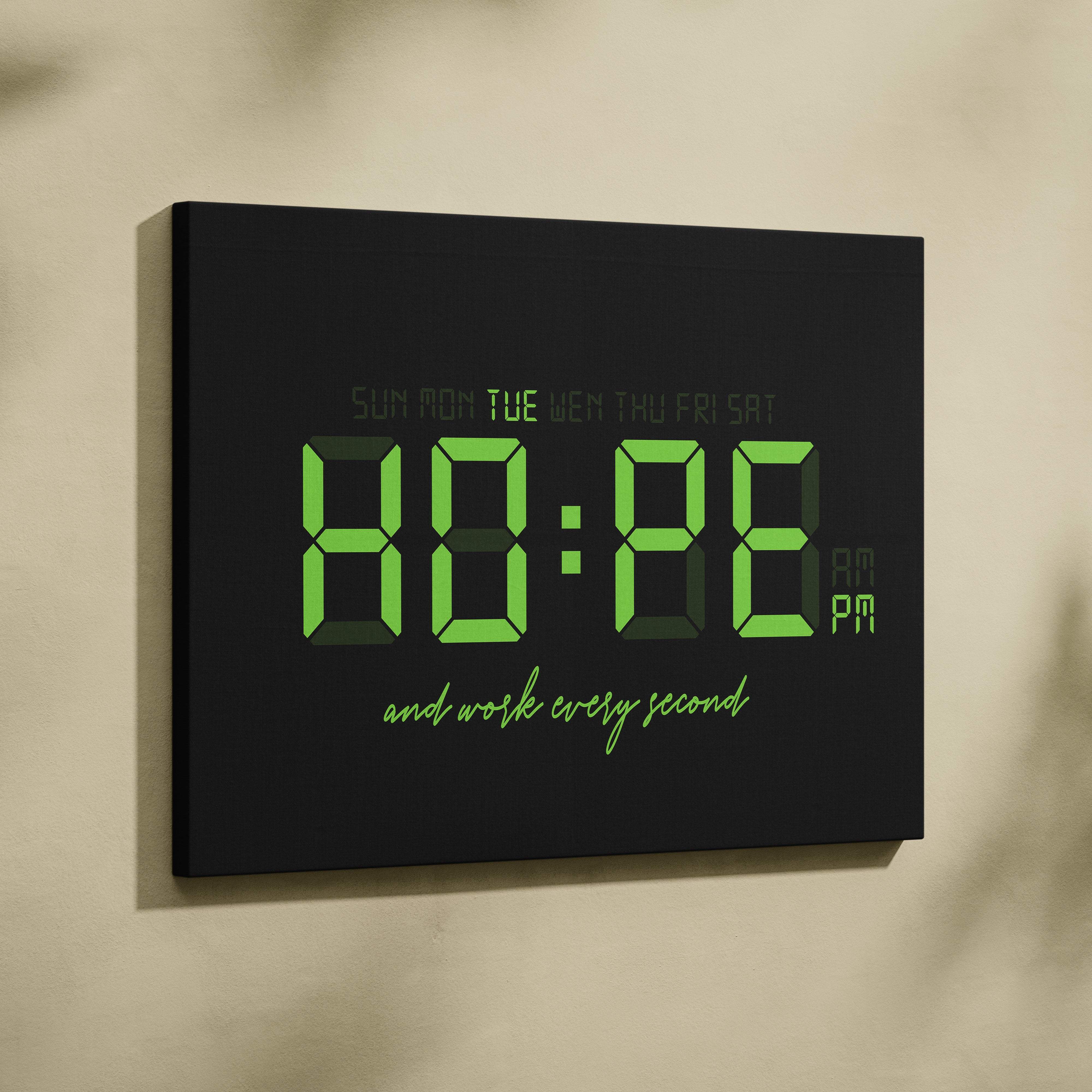 Black digital wall clock with glowing green led display showing time days and cursive motivational phrase for office decor