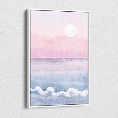 A framed watercolor boho pastel ocean sunset canvas art with pink and blue hues in a sleek white frame