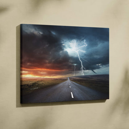 Canvas print of a dramatic lightning storm over an empty road at sunset with blue thunder sky and fiery horizon