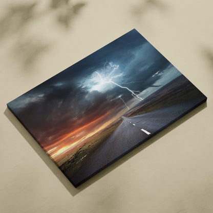 Canvas print of a lightning strike over an open road at dusk with blue thunder sky and fiery orange sunset horizon wall decor