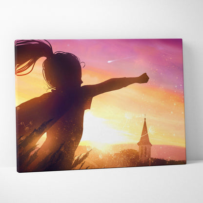 Dreamy sunset freedom canvas wall art with girl silhouette and church steeple against a golden pink sky