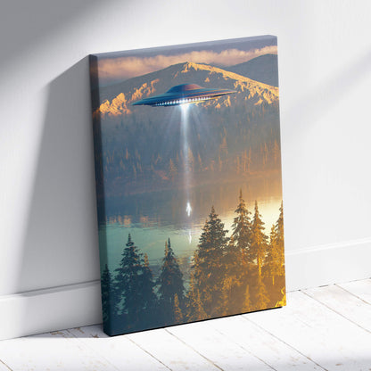 A canvas print of a sleek dark blue ufo with glowing lights over a mountain lake at sunset with beam light