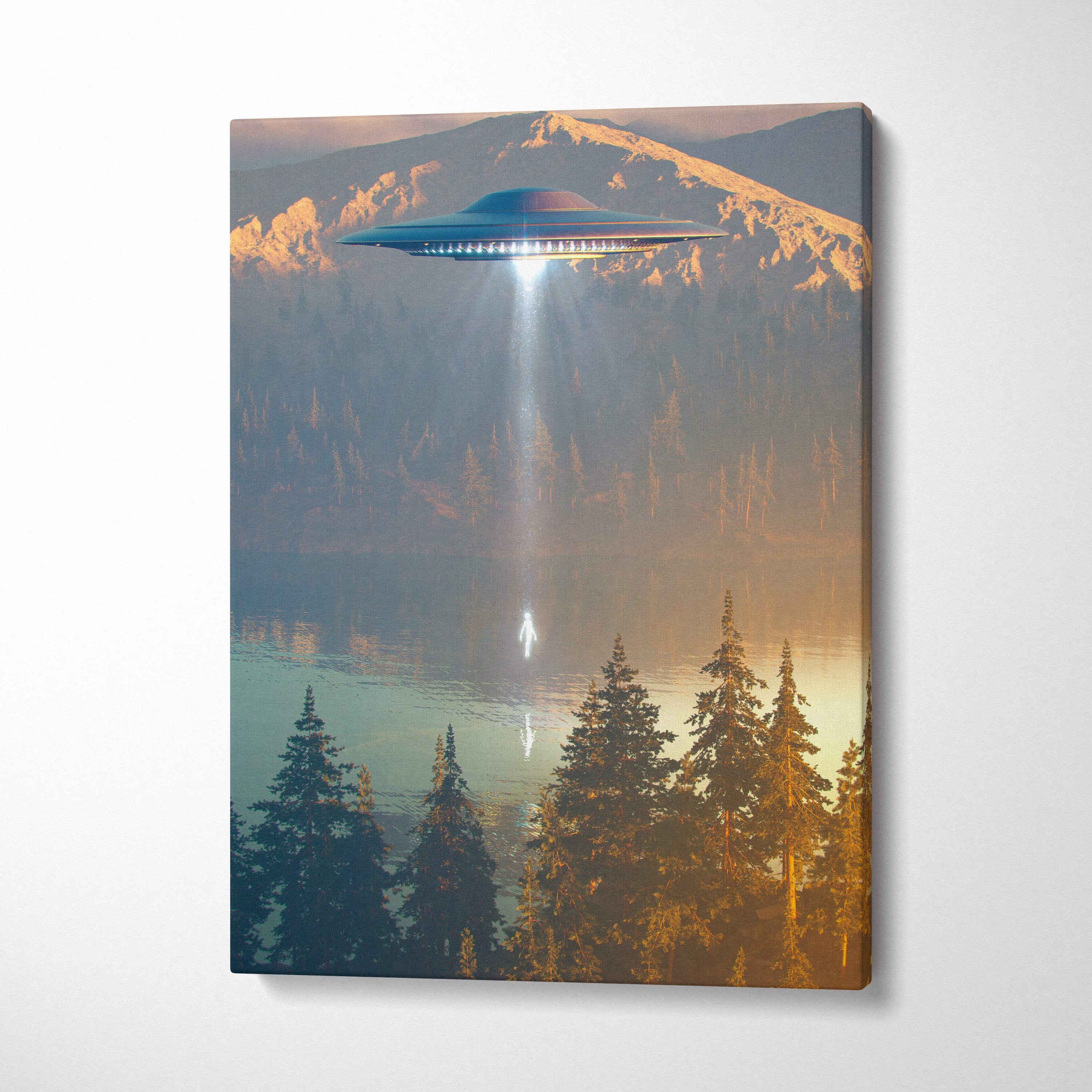 Ufo abduction canvas wall art with a sleek metallic blue ufo glowing over a misty lake and snow-capped mountains