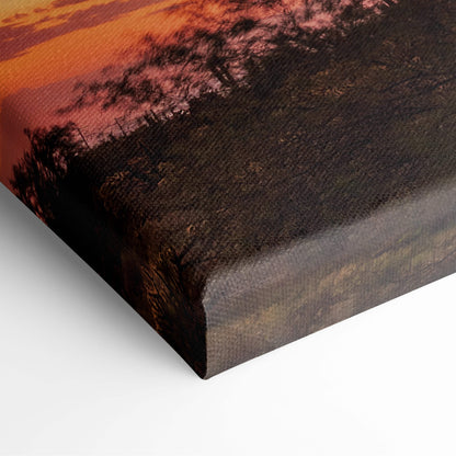 Canvas print featuring a purple sunset sky with cactus landscape in warm orange and deep brown tones on textured canvas