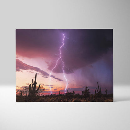 Rectangular canvas print of desert lightning storm with purple and pink sky and silhouetted cactus landscape wall decor