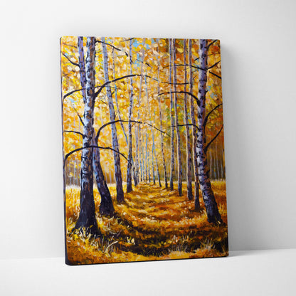 Autumn birch forest canvas print shows a forest path with white and gray tree trunks and golden yellow leaves