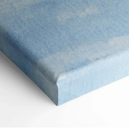 Blue textured watercolor sky canvas print with white clouds and navy gradient