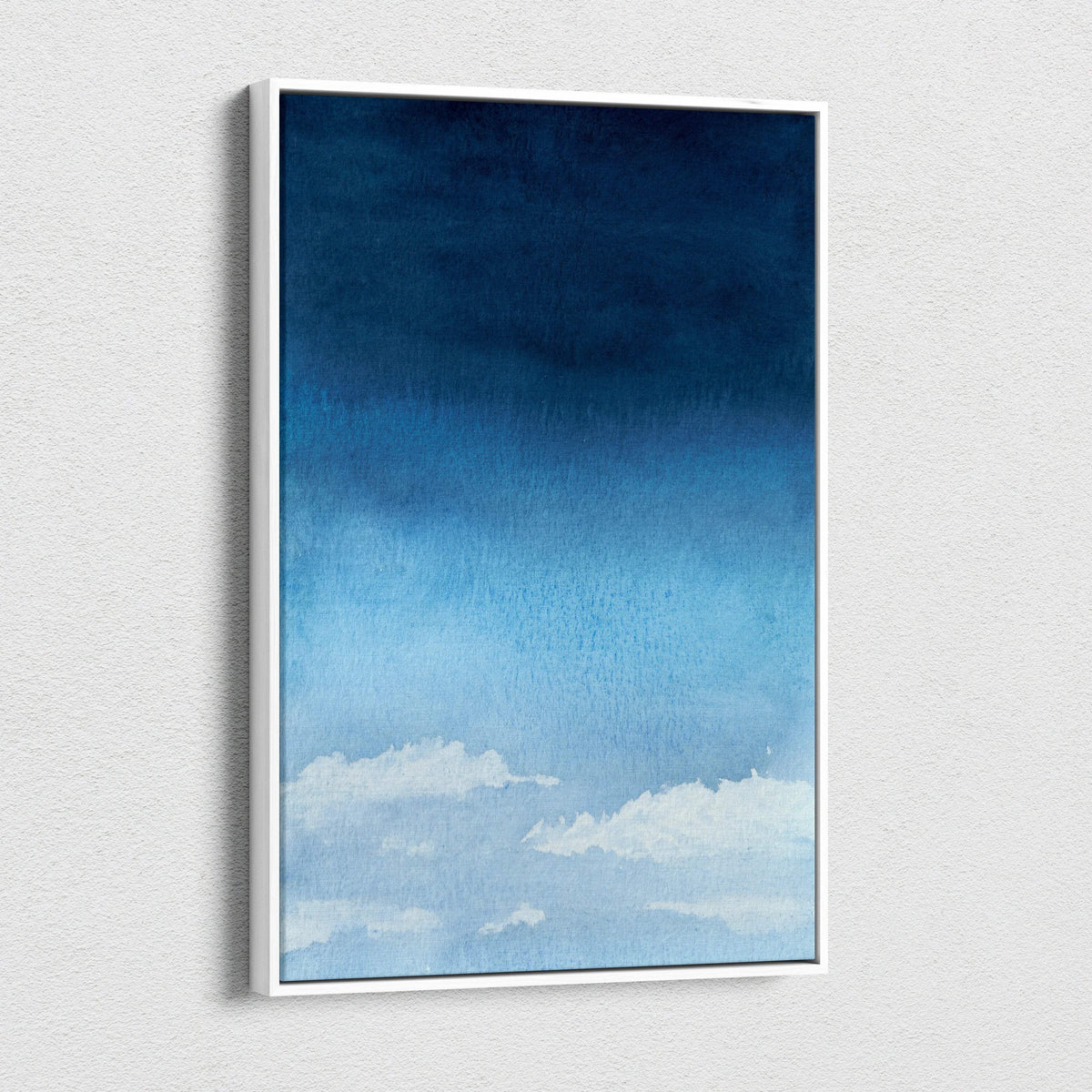 Minimalist watercolor sky canvas art with soft white clouds, navy pale blue gradient in white frame