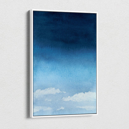 Minimalist watercolor sky canvas art with soft white clouds, navy pale blue gradient in white frame