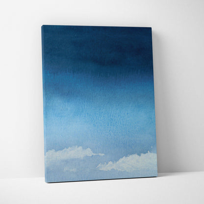 Minimalist watercolor sky canvas art with deep navy to pale blue gradient and soft white clouds