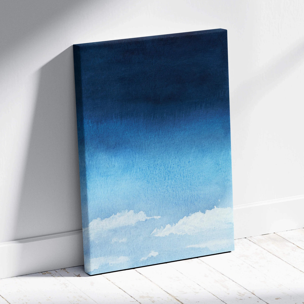 Minimalist watercolor sky canvas art with deep navy to pale blue gradient and soft white clouds