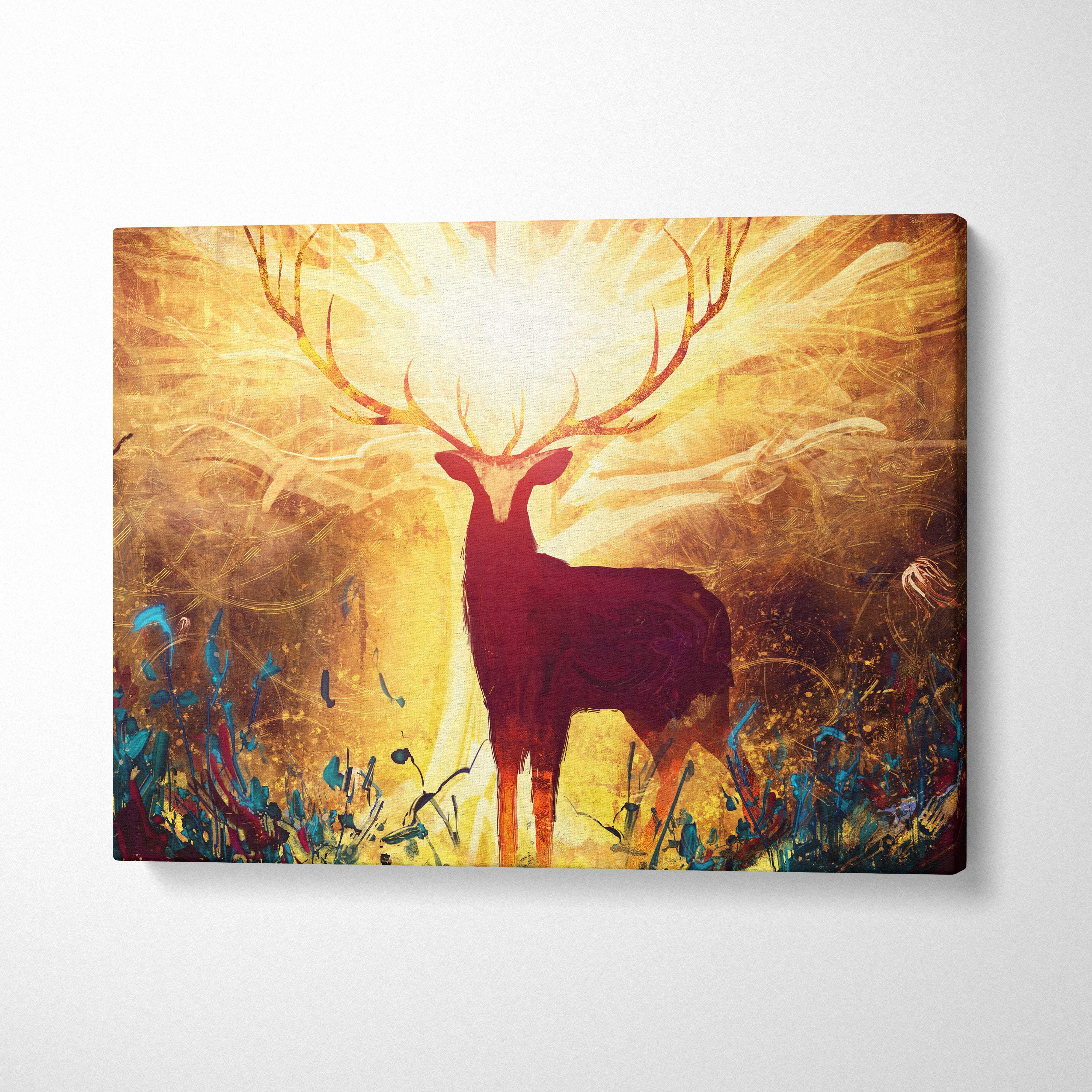 A vibrant canvas print of a majestic deer silhouette with glowing golden antlers and a radiant sunburst background