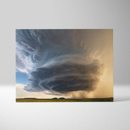 Rectangular canvas art of a dramatic swirling supercell thunderstorm with dark clouds over a green field and golden sky