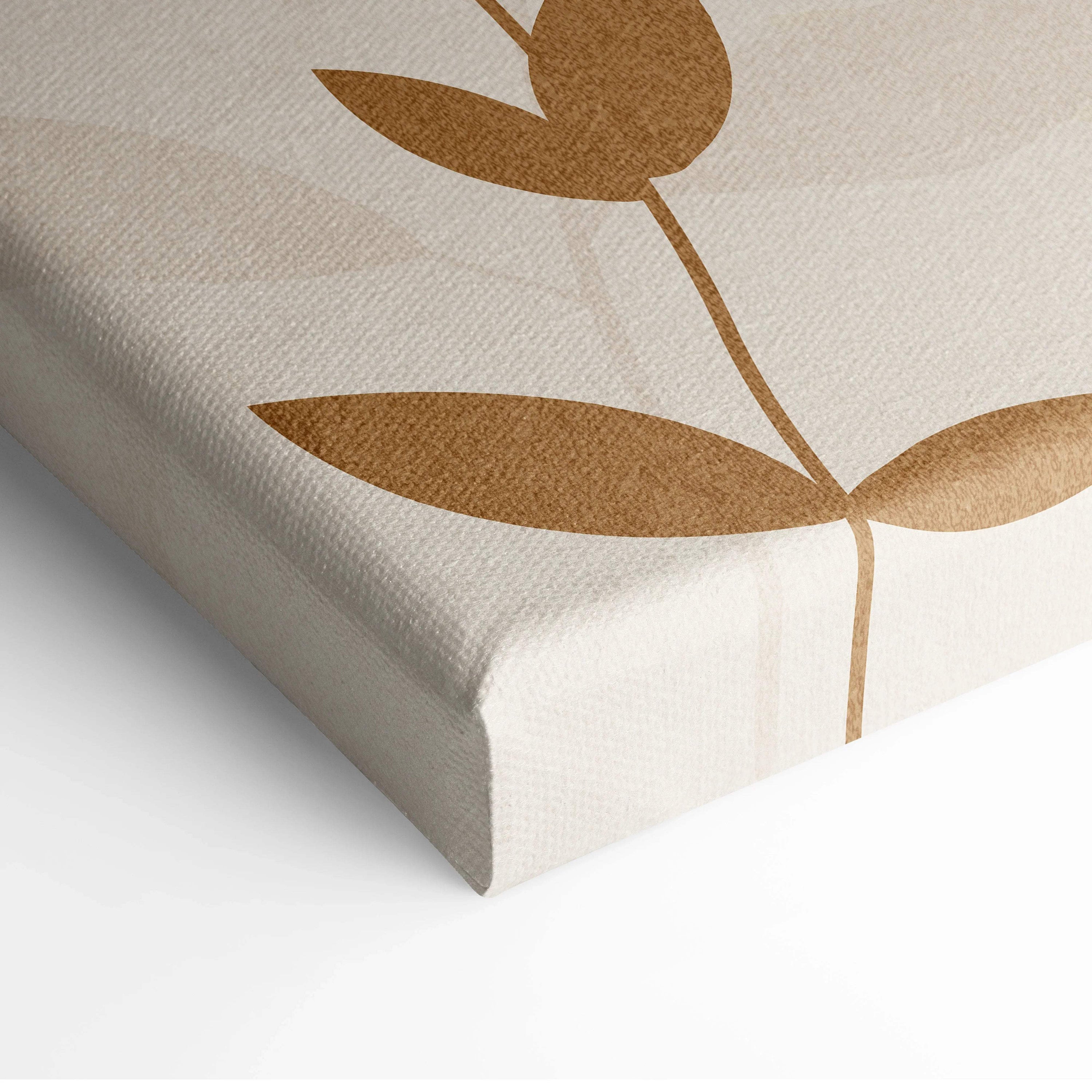 Elegant beige canvas wall art with minimalist gold-toned botanical leaves