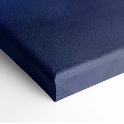 Haunted castle canvas print in deep navy blue with textured woven surface and slightly raised edges for gothic wall art