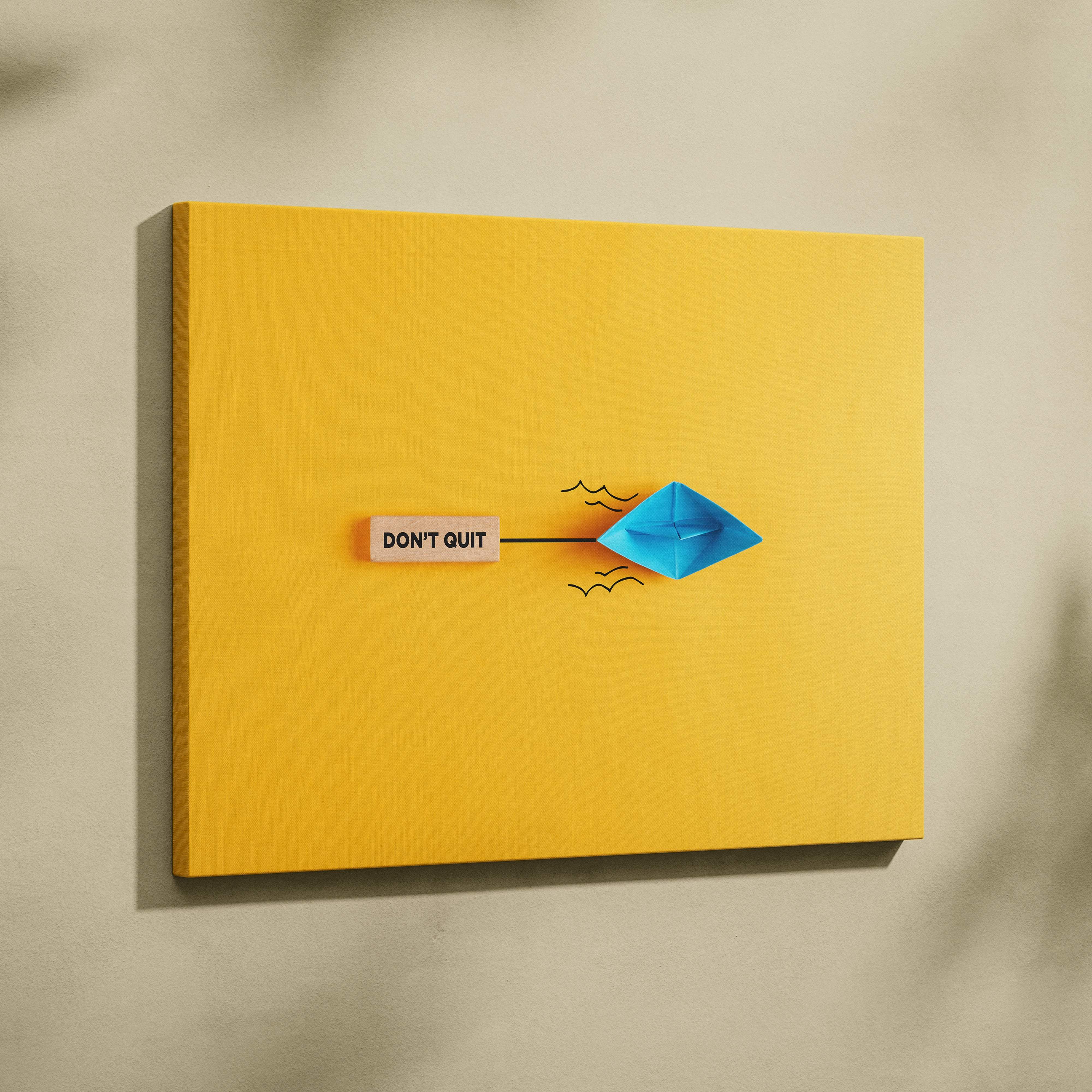 Motivational dont quit canvas wall art with blue origami boat on vibrant yellow background for office or bedroom decor