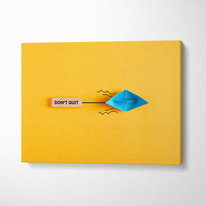 Motivational dont quit canvas wall art with blue origami boat black ink waves on vibrant yellow background and wooden plaque