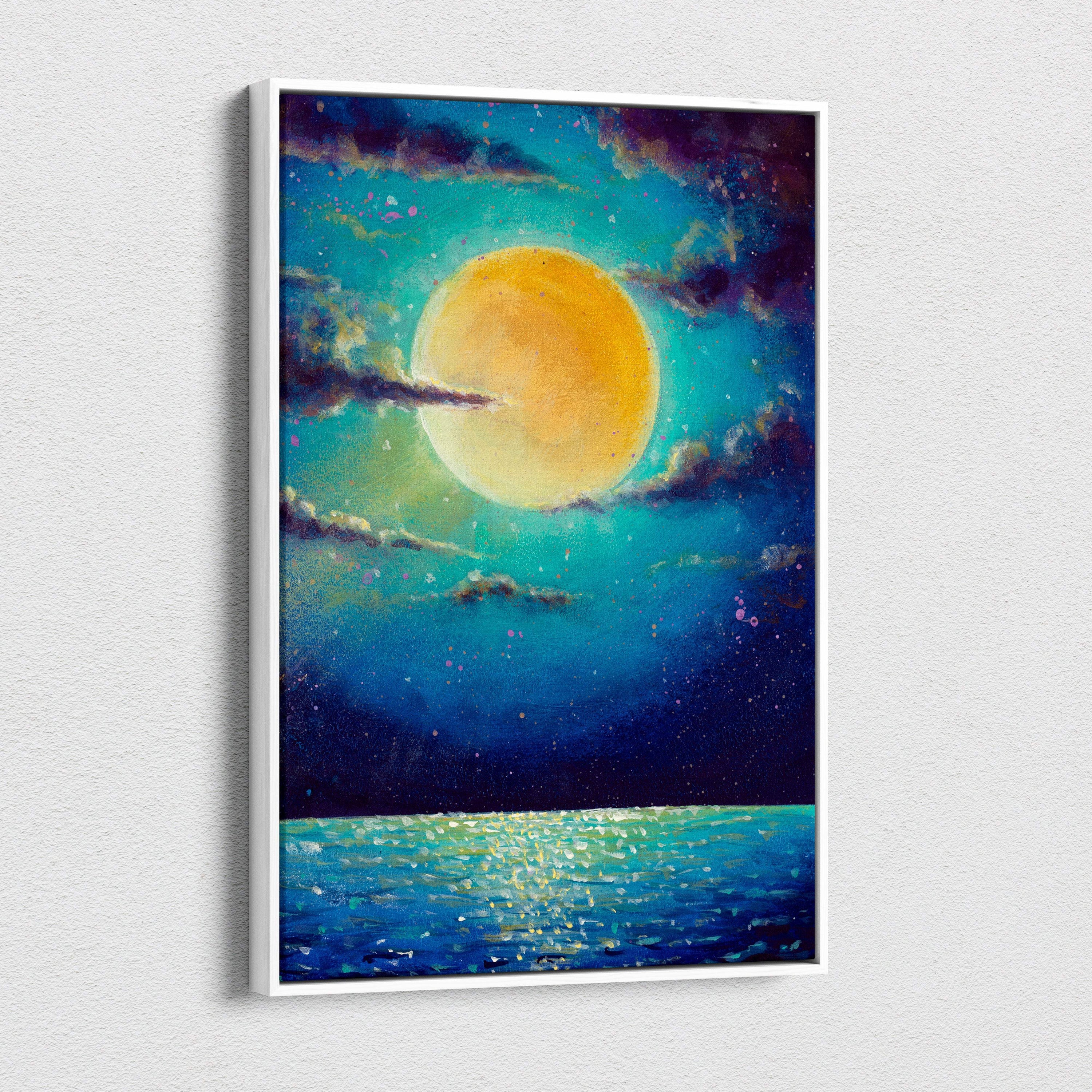 A framed canvas print of a vibrant yellow moon glowing over a deep blue ocean under a starry sky with swirling clouds