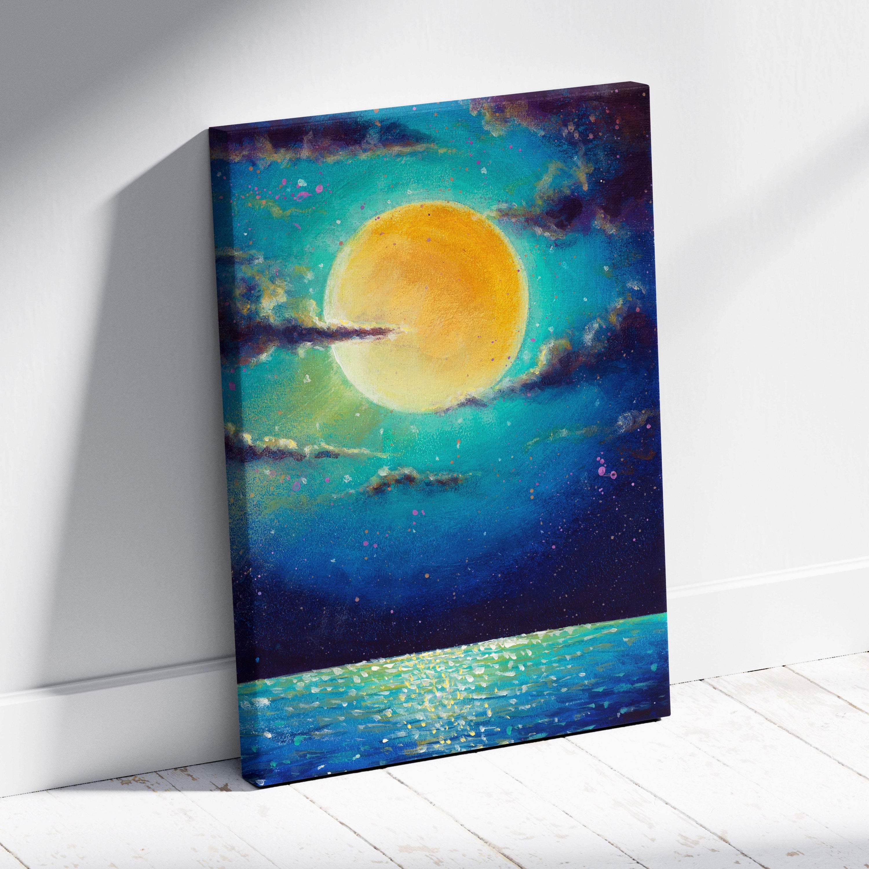 Vibrant canvas print of glowing golden moon over teal and deep blue sky reflecting on turquoise water