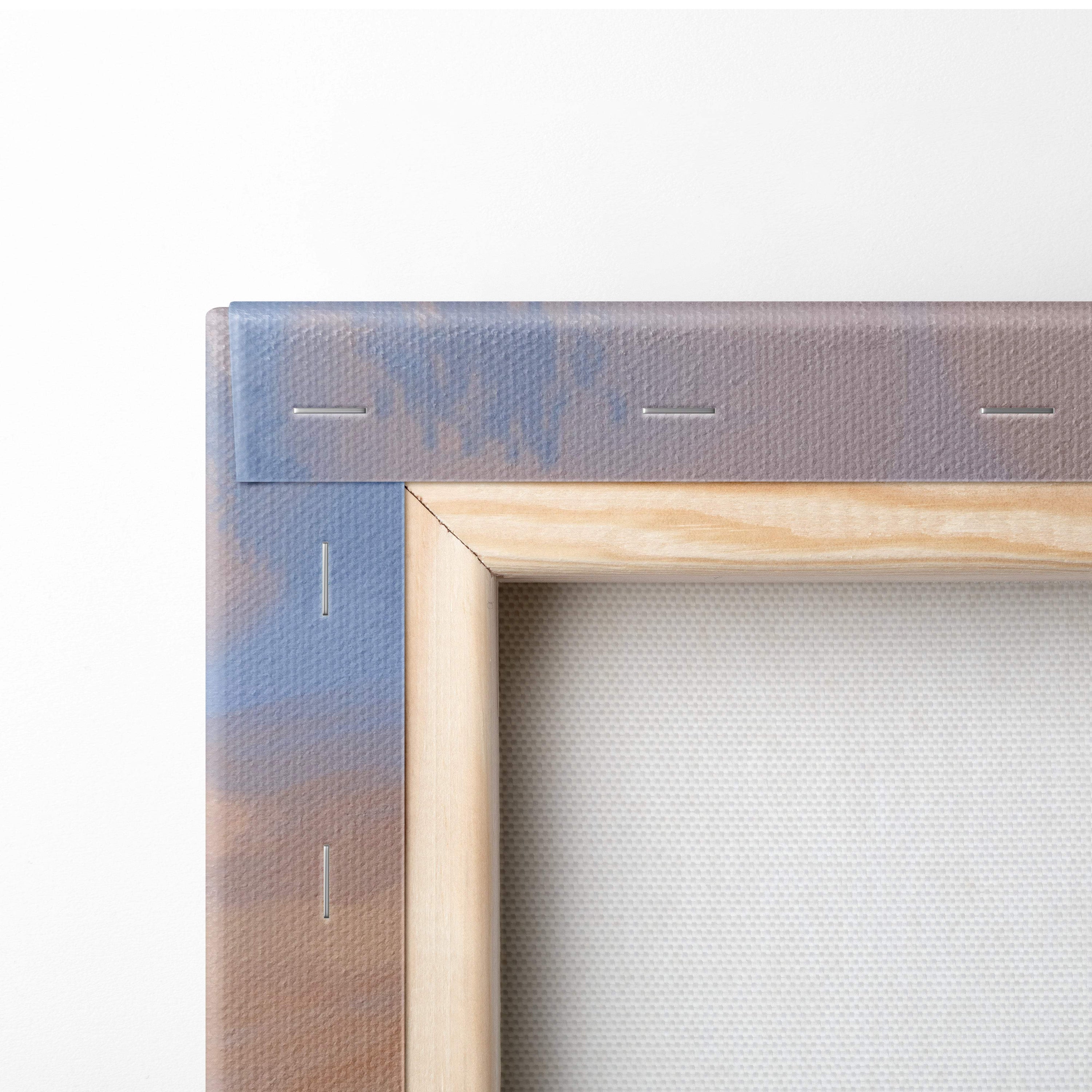 A wooden canvas frame with gradient blue to brown border and stitching for soft pastel countryside landscape art