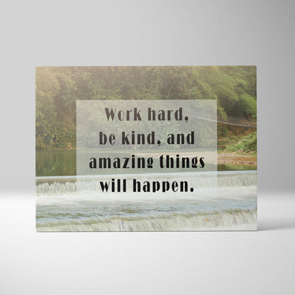 Rectangular canvas wall art with a serene river scene and motivational work hard be kind quote for living room decor
