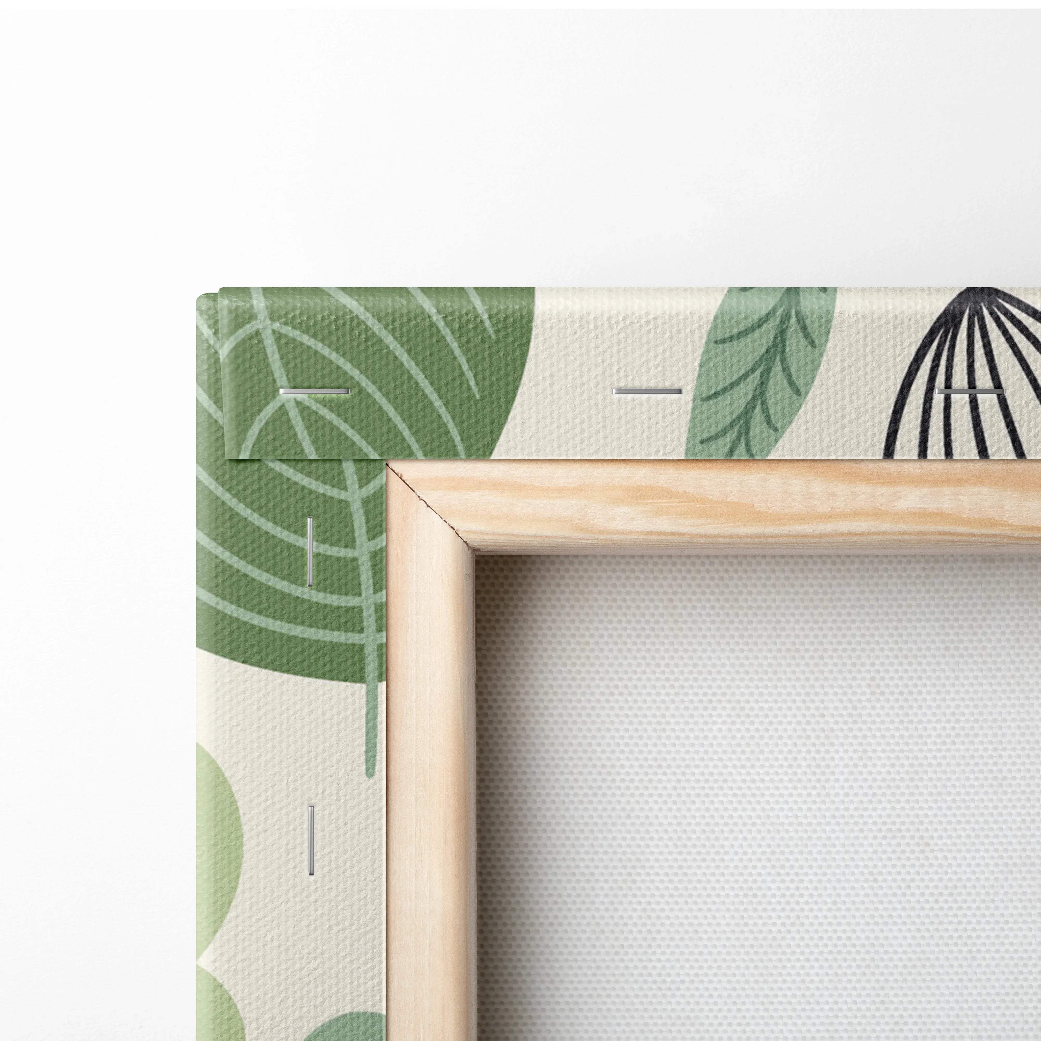 Light wood-framed canvas with sage green botanical leaves print