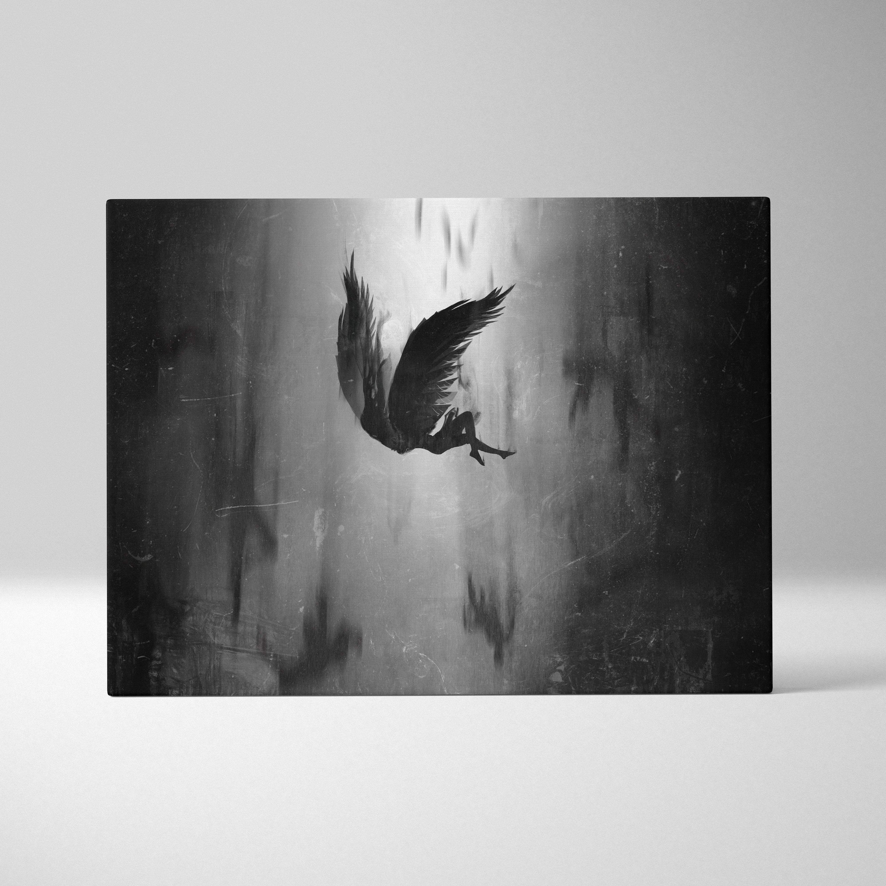 Black-and-white canvas print of a silhouette angel with tattered wings falling through a misty gothic textured background