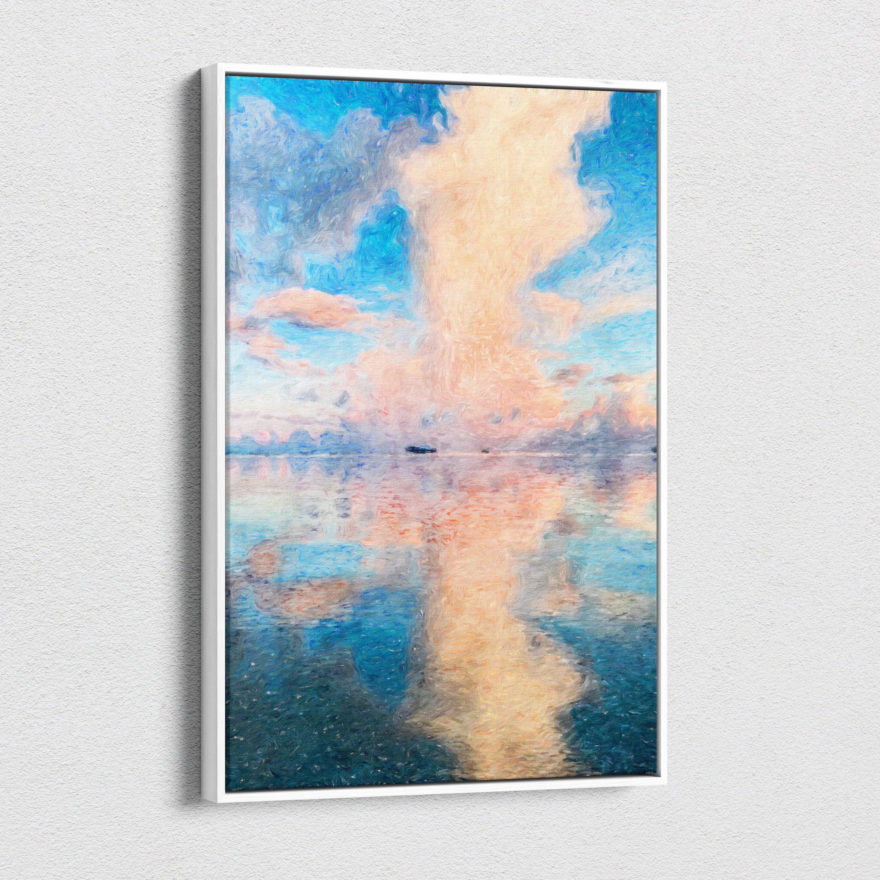 A framed white canvas print of a soft pastel seascape with blush pink and blue sky reflected in calm water