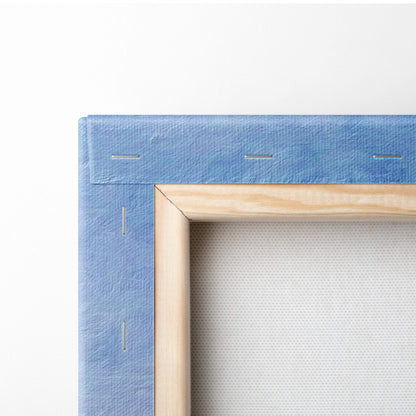 Light blue textured canvas with visible stitching and natural wood frame of tropical pink sunset beach wall art