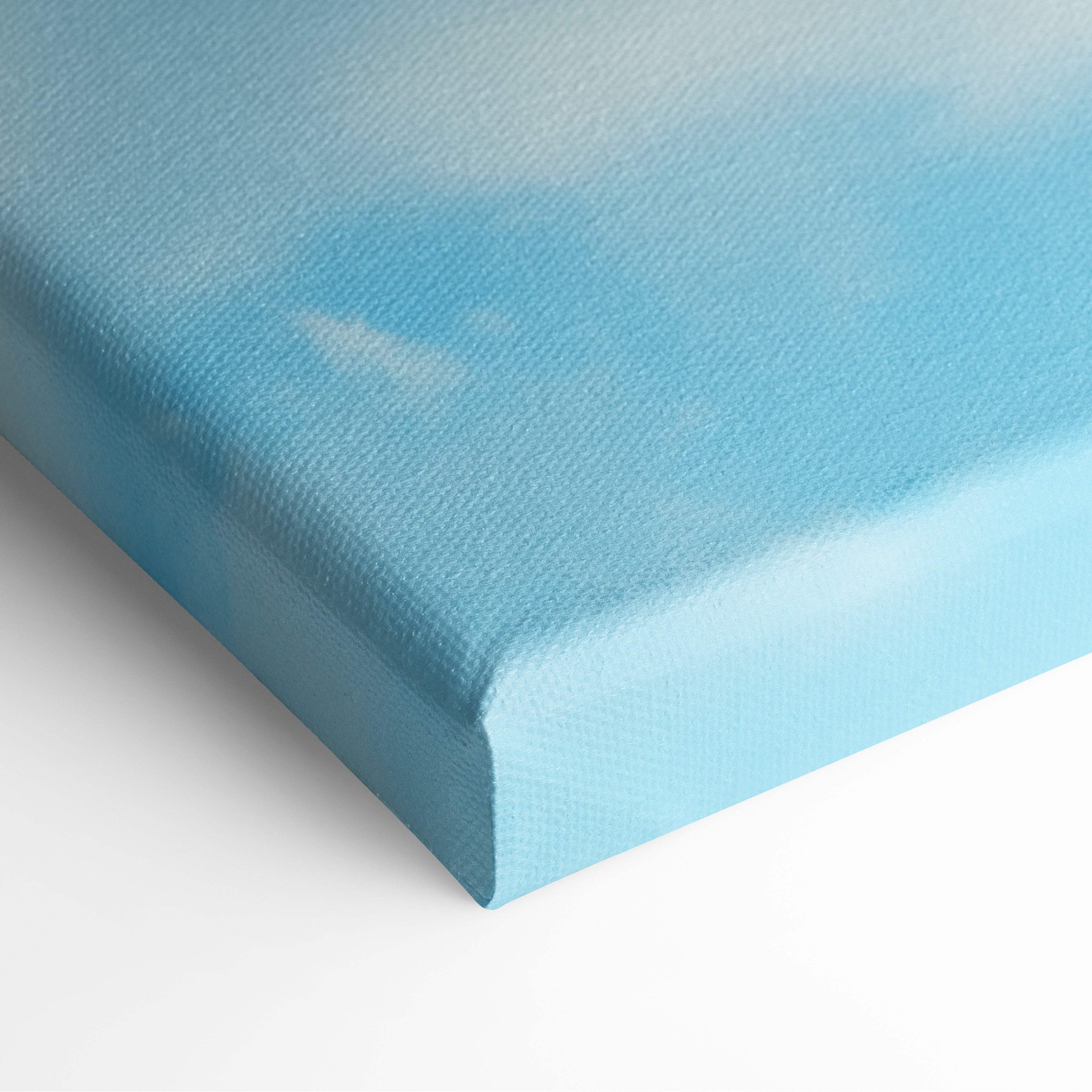 A light blue canvas print with soft cloud texture featuring motivational live your dream typography for home or office decor