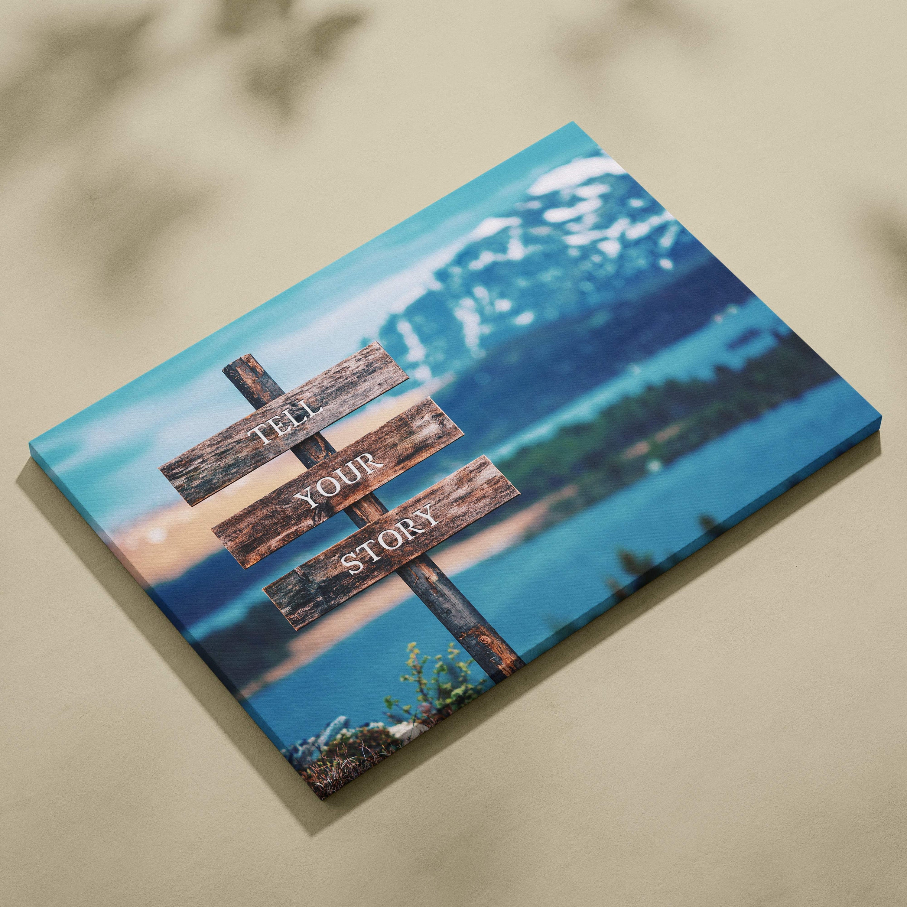 Motivational tell your story canvas print with rustic wooden signpost and blue mountain lake nature decor
