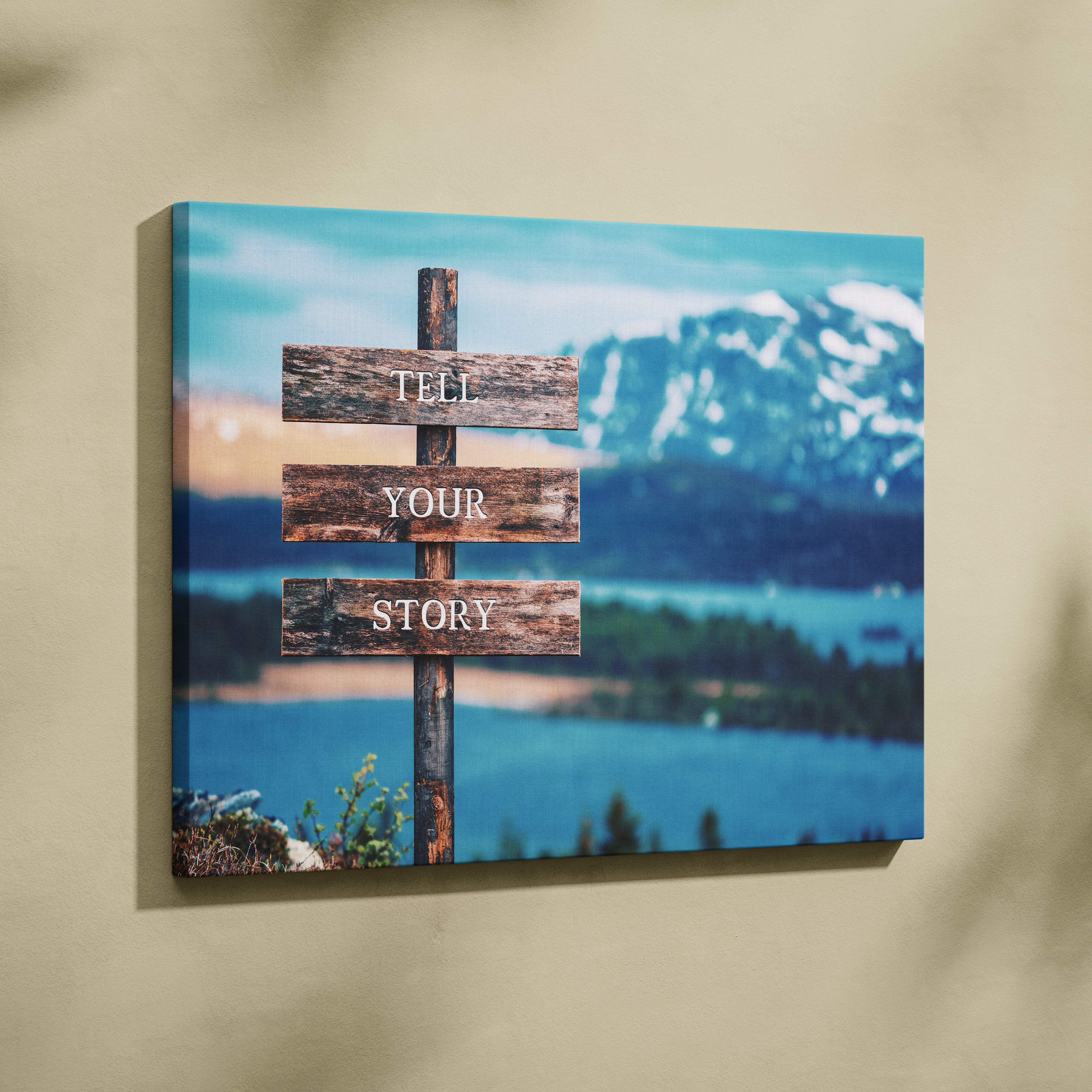 Motivational tell your story canvas wall art featuring a rustic wooden signpost over blue mountain lake decor