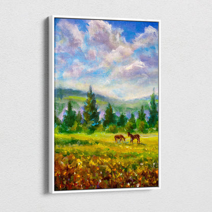 A framed impressionist canvas print of two brown horses grazing in a sunlit meadow under a soft cloudy sky