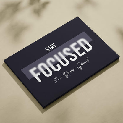 Black canvas print with bold white and cursive stay focused on your goal motivational phrase for office gym decor