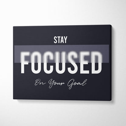 Black canvas print wall art with stay focused on your goal motivational phrase in white typography for office bedroom gym decor