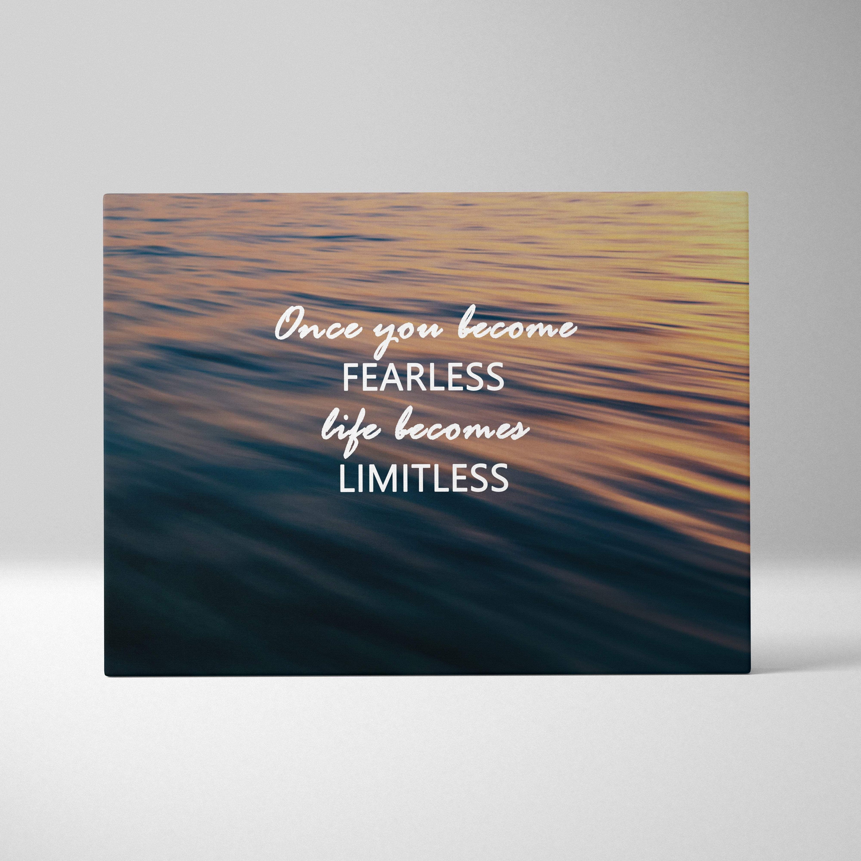 Fearless and limitless motivational canvas print with golden and blue ocean scene and inspirational white script text