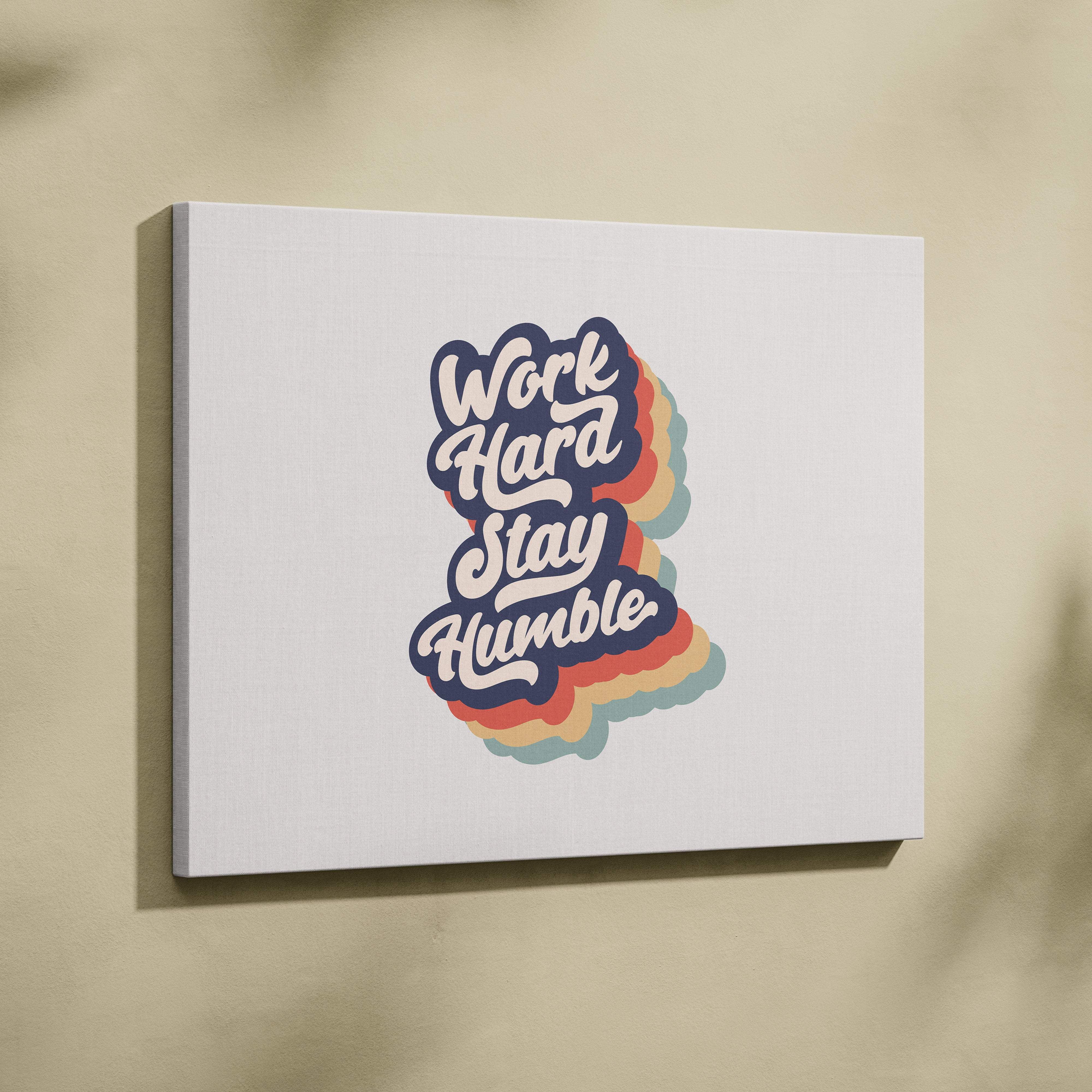 White canvas wall art print with work hard stay humble colorful rainbow gradient lettering for office gym decor