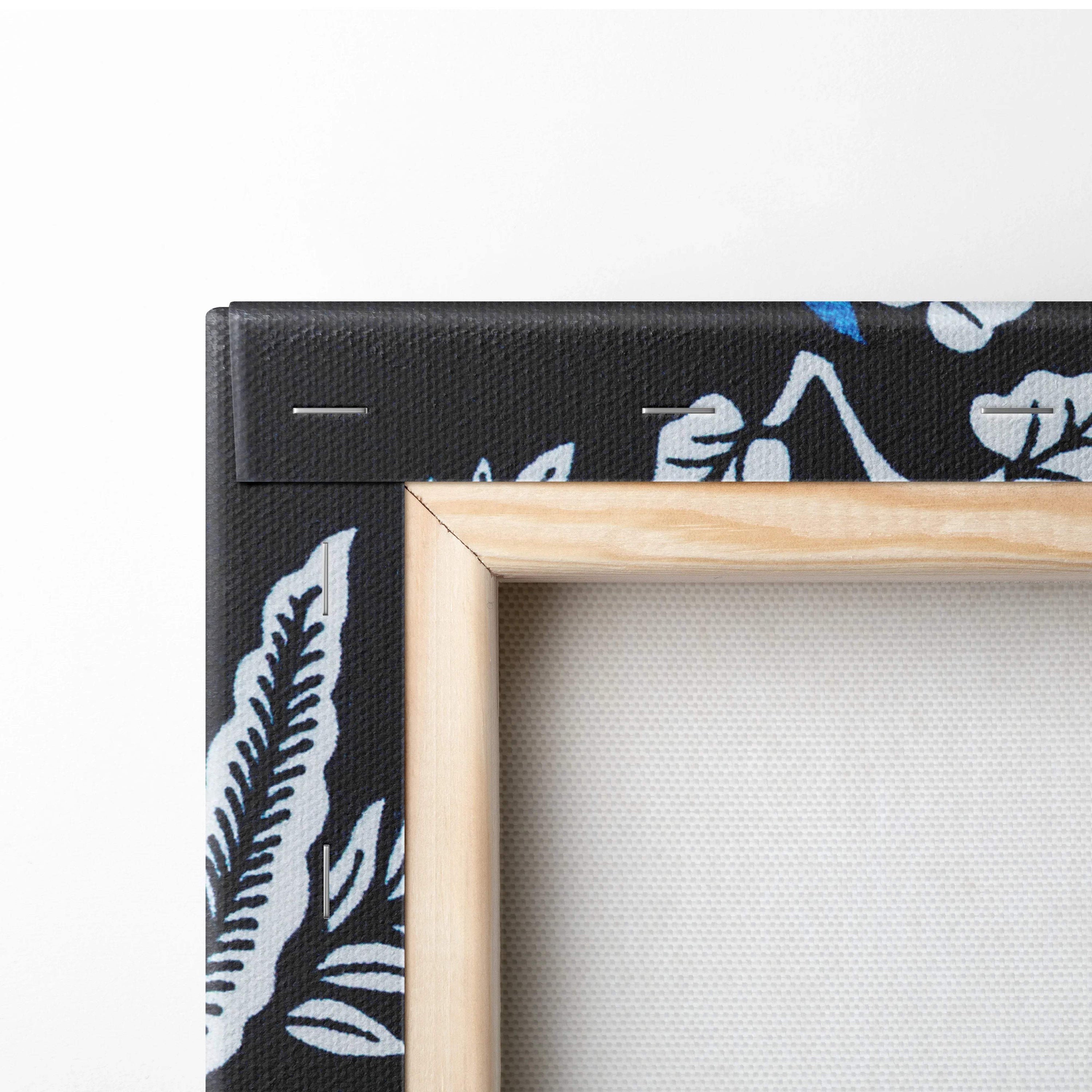 Light wood frame with black canvas of blue white botanical leaves art