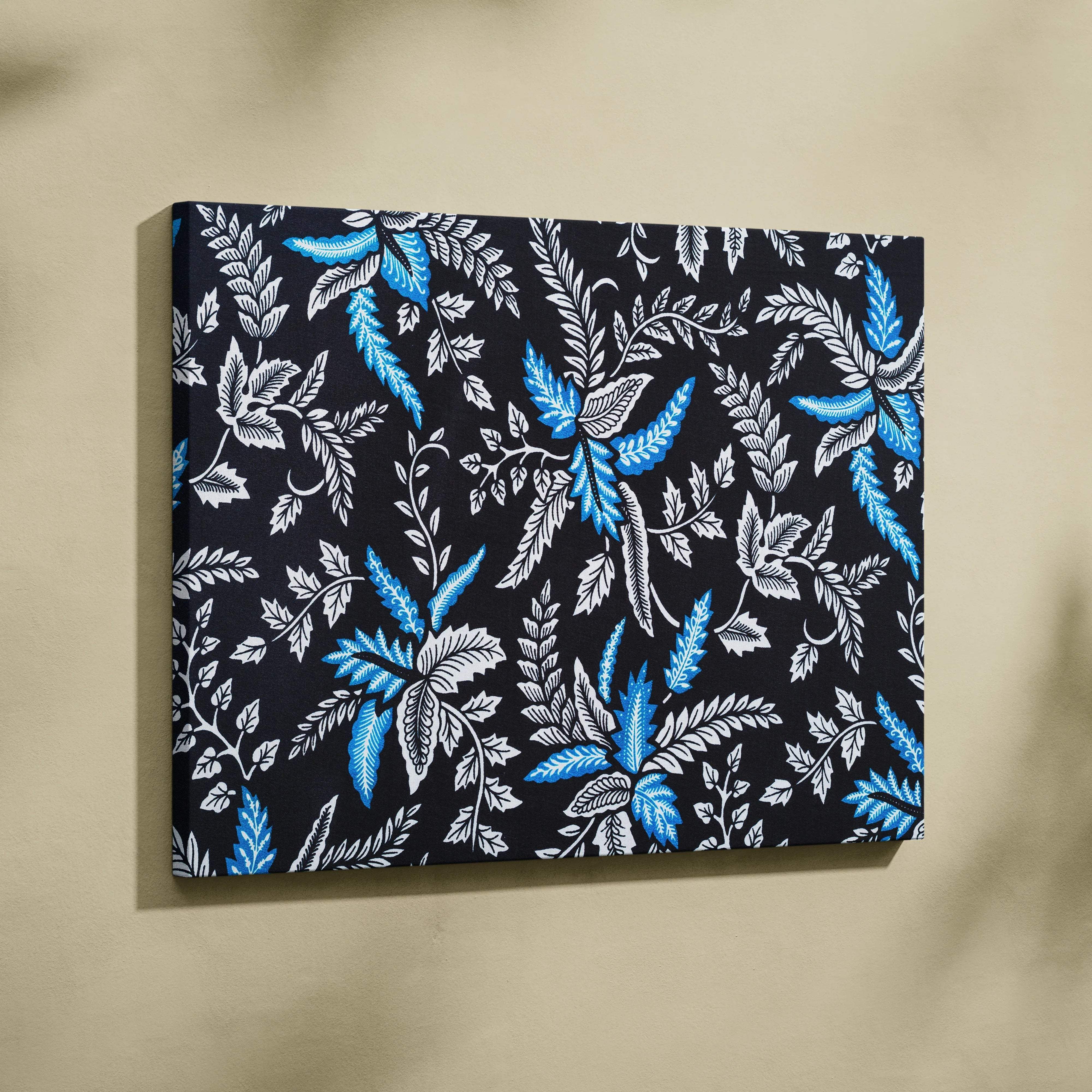 Elegant black canvas wall art with blue white botanical leaves