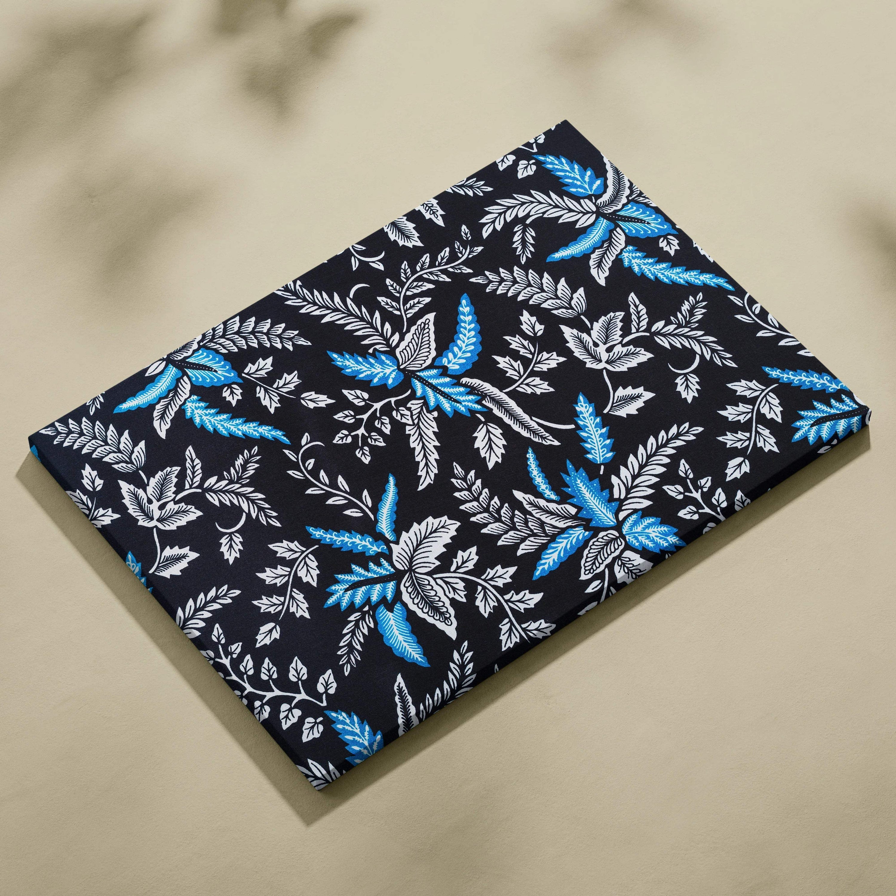 Elegant black canvas wall art with blue white botanical leaves vines