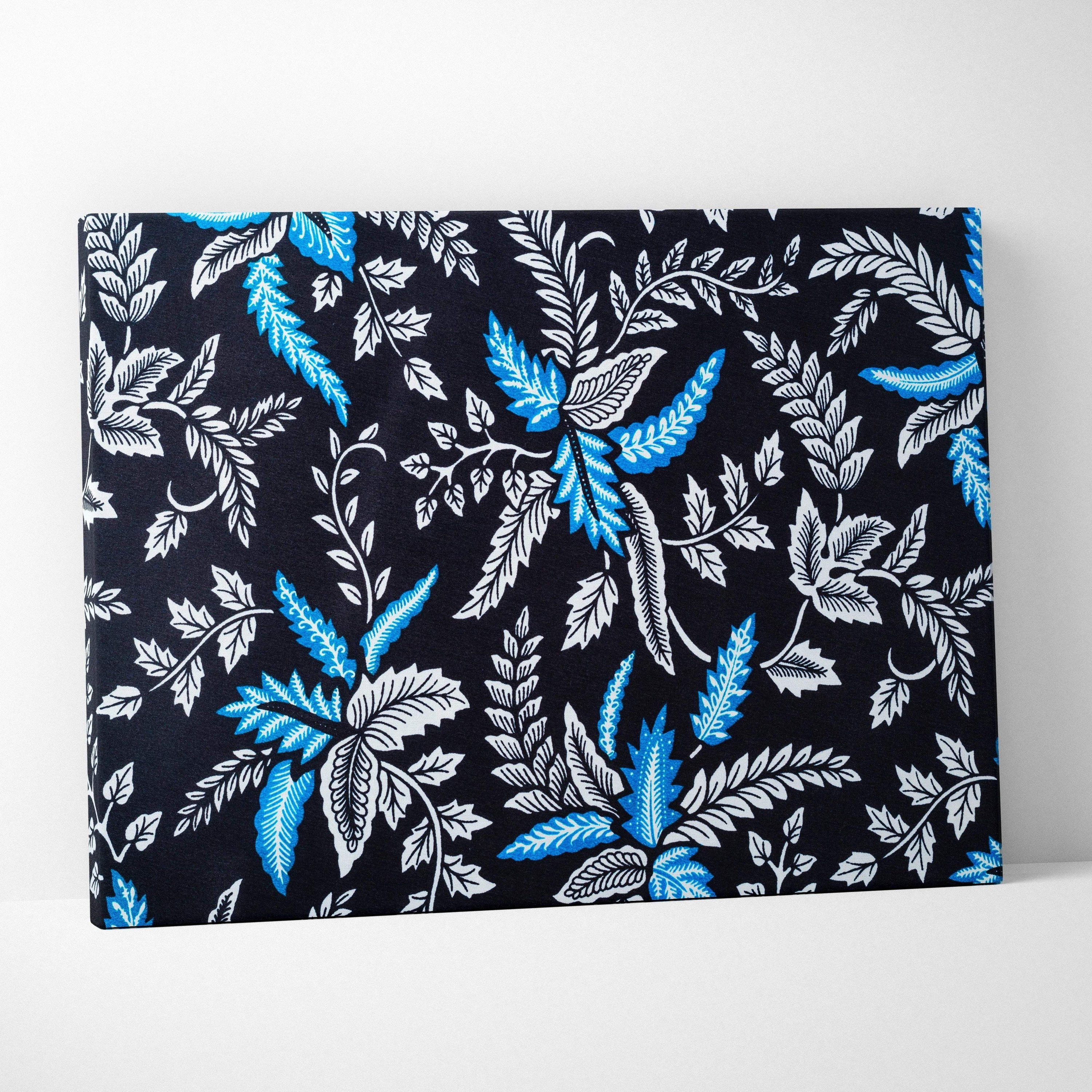 Elegant black canvas wall art with blue white botanical leaves