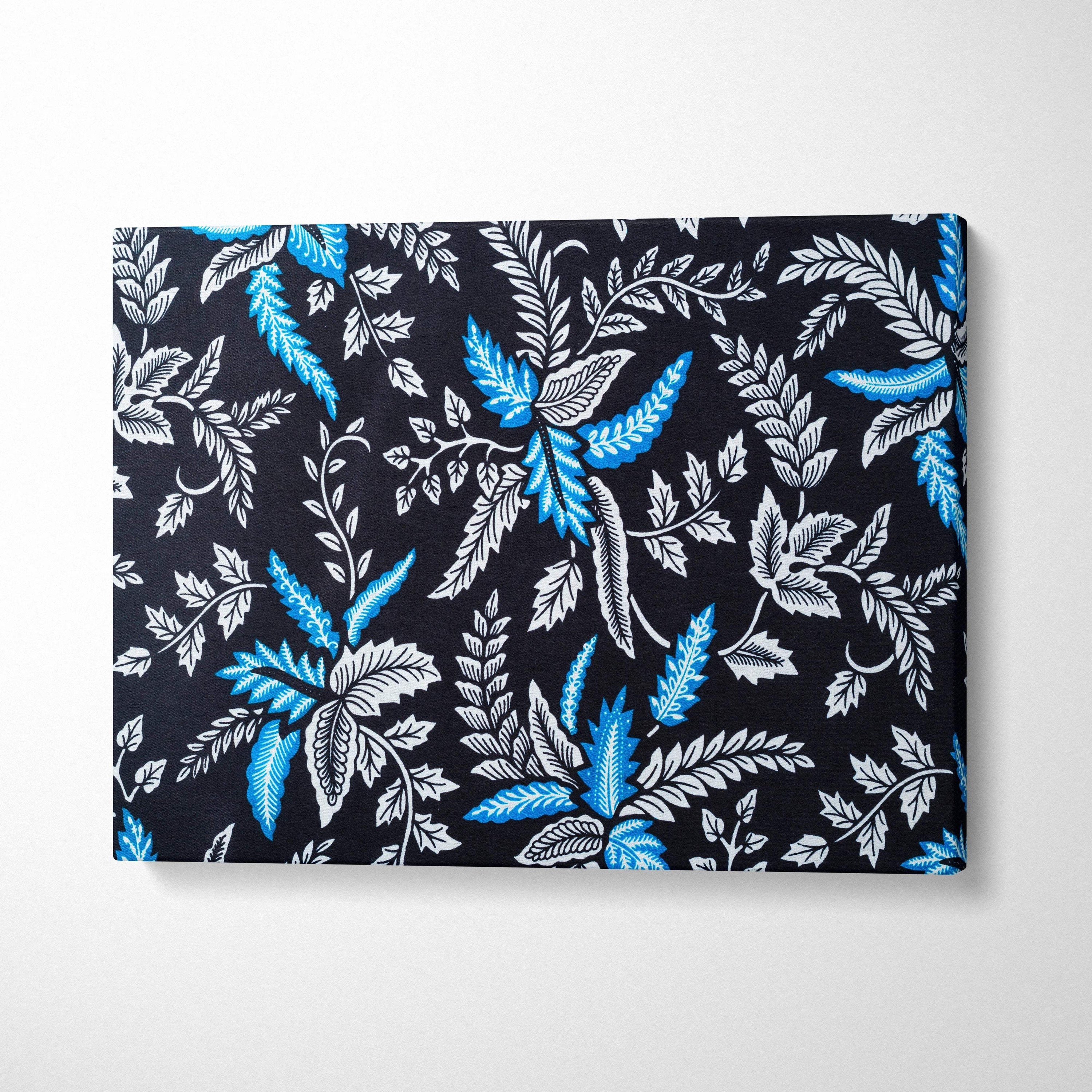 Elegant black canvas wall art with blue white botanical leaves