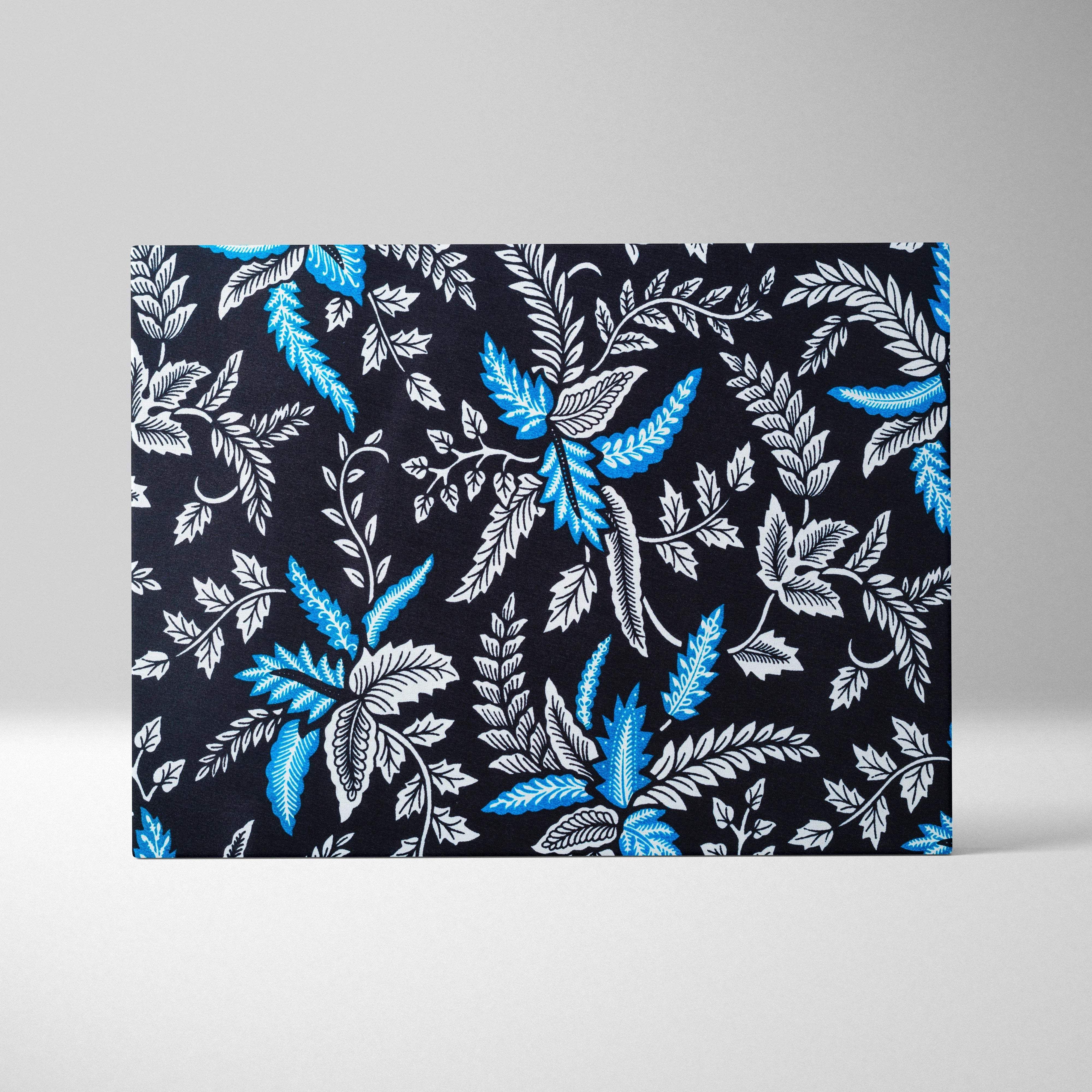 Elegant black canvas wall art with vibrant blue white botanical leaves