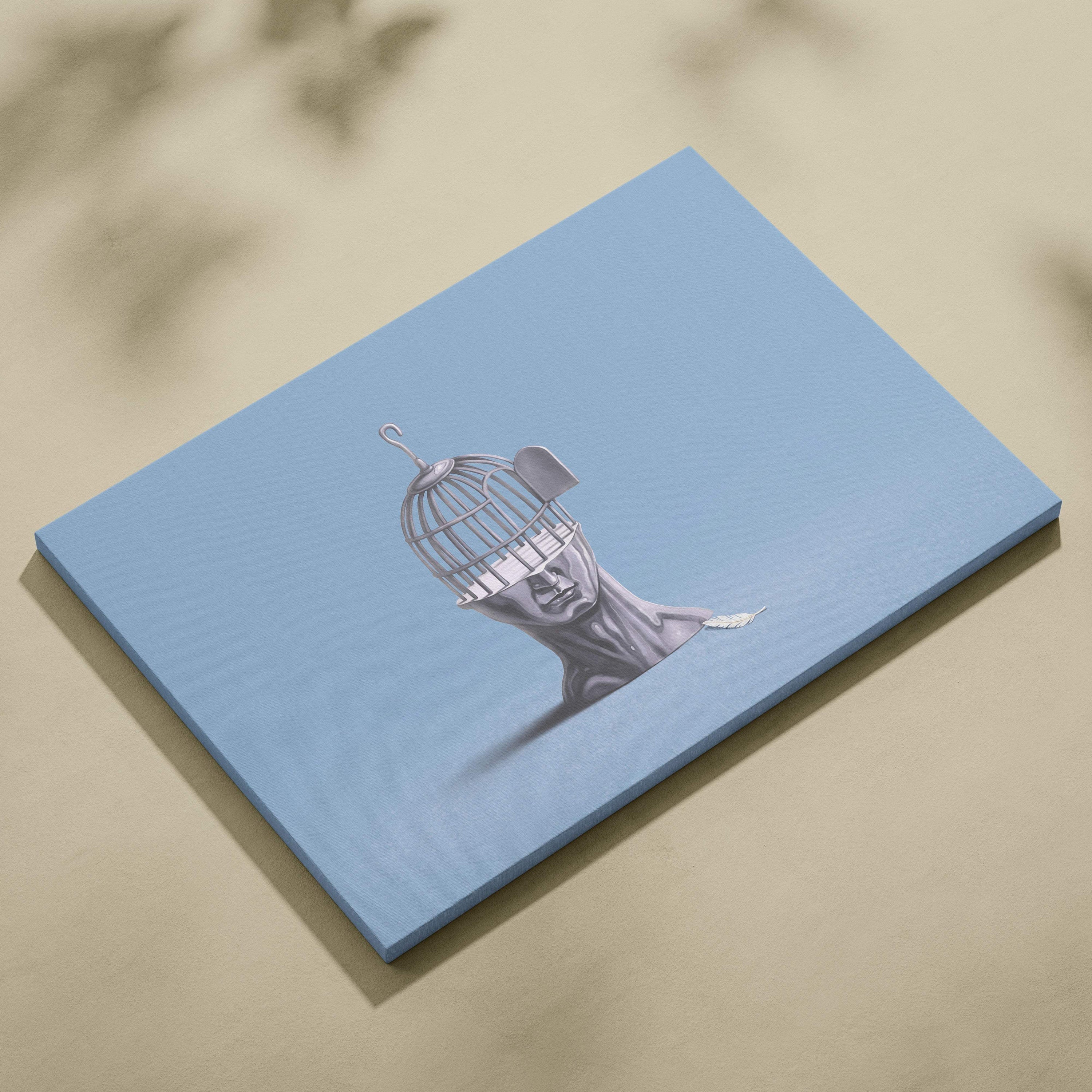 Light blue canvas wall art with grayscale human head illustration and birdcage face symbolizing mind freedom