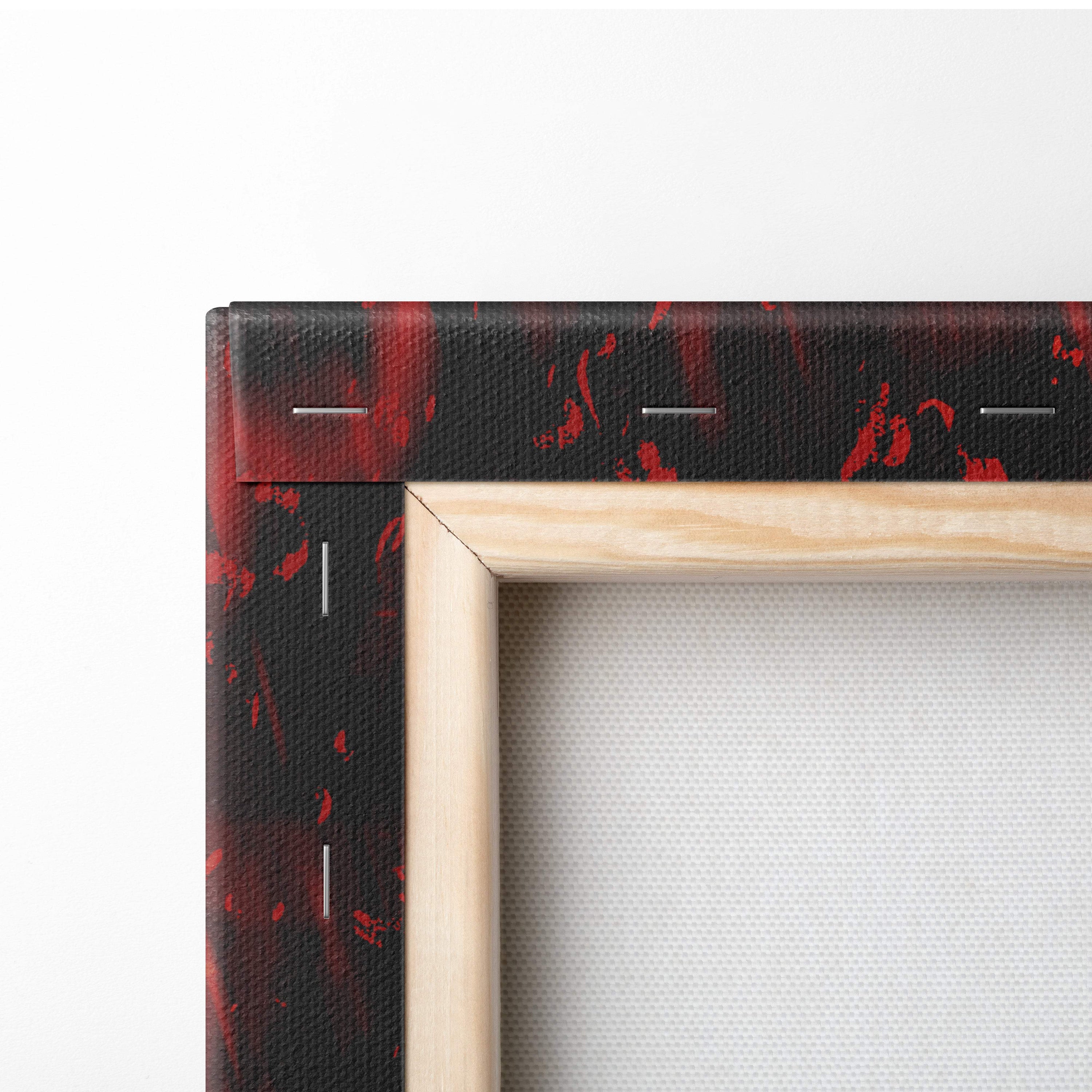 Inferno warrior goddess canvas art featuring black canvas with red splatter design framed in light wood for wall decor