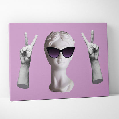 A white marble bust wearing black sunglasses with two peace sign hands on a lavender background wall art